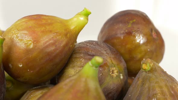 Juicy organic  figs close-up food background panning 4K 2160p UHD footage - Tasty figs on white orga