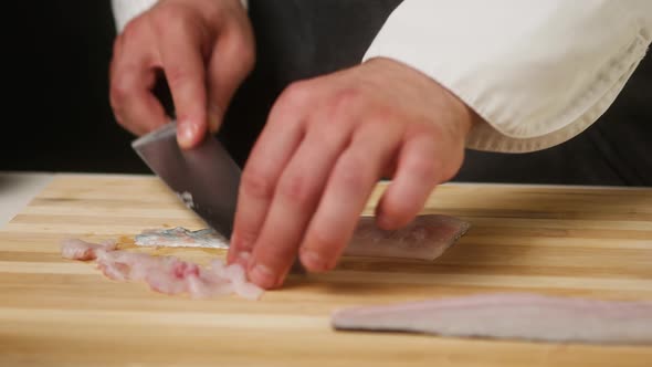 Professional Chef Cutting Raw White Fish Closeup Thin Slices