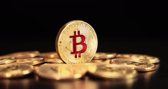 Gold Bit Coin BTC Cryptocurrency Coins on a Black Background