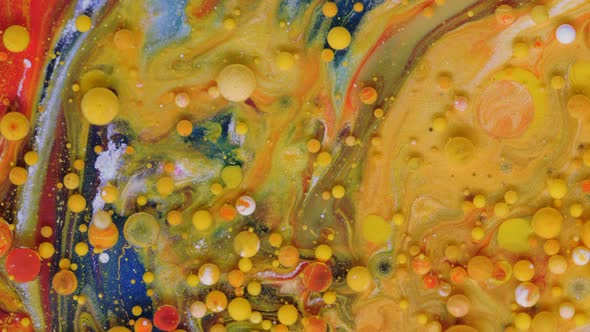 Red Blue and Yellowgolden Bubbles on a Red Background