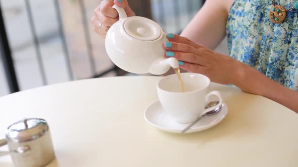 Happy Smiling Woman Making Green Tea Outdoors. Summer Background. Healthy Eating Concept. Shallow