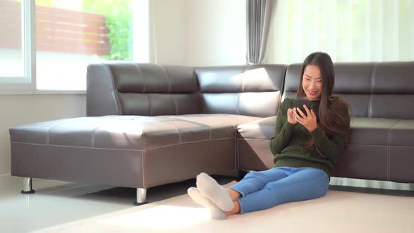 Young asian woman use smart phone