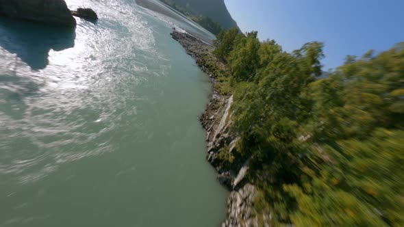 Aerial Rotation View Lonely Travel Woman Sitting Cliff Stone Structure Admiring Fast Mountain River