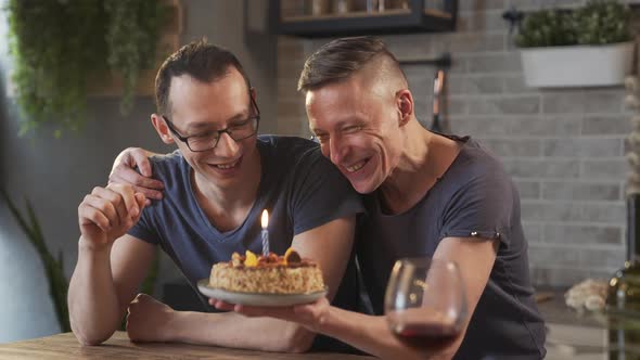 Gay Couple Celebrating Birthday with Cake