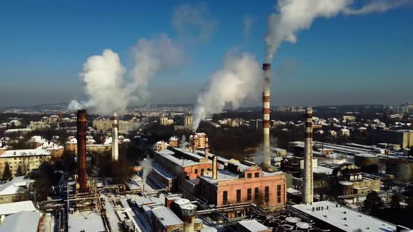 Aerial view of a drone flying over an industrial plant