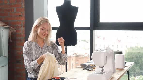 Fair-haired Young Woman Gets Pleasure From Needlework