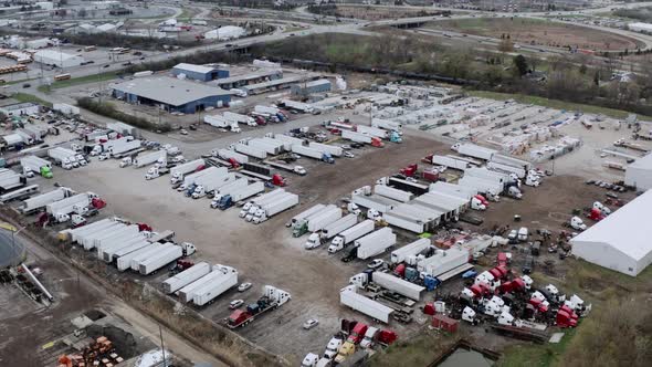 Aerial Drone View of Truck Repair Shop Service Building and Many Trucks Near It USA