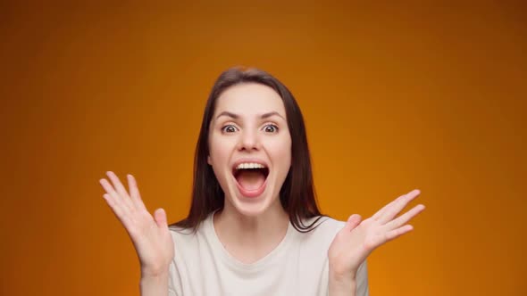 Portrait of Woman Shocked and Surprised with Good News