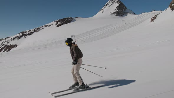 Young Woman Skiing Downhill Slope