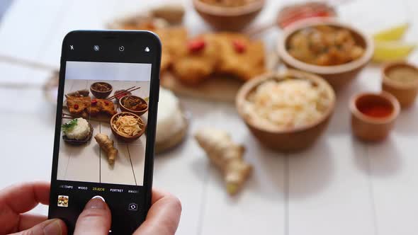 Woman Taking Photo of Chinese Style Deep Fried Battered Chicken