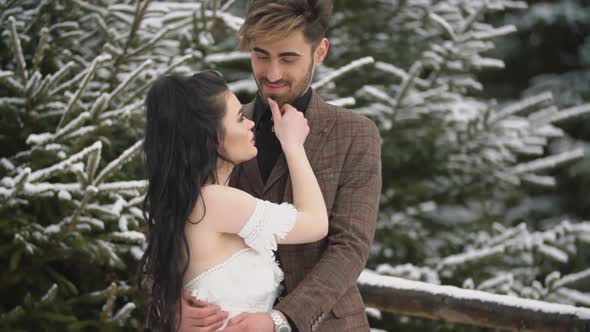 Young Couple Cuddling in the Forest