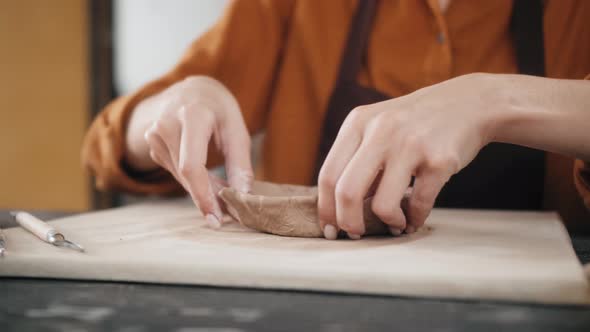 Potter Masterclass Man and Woman are Working with Pottery Wheel Making Pots During Master Class for