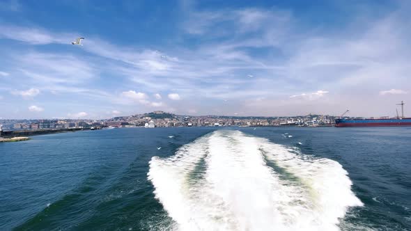 Naples Coastline and Cityscape From a Moving Boat in the Sea in Summer Season