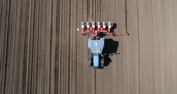 Aerial view of tractor sowing in agriculture area