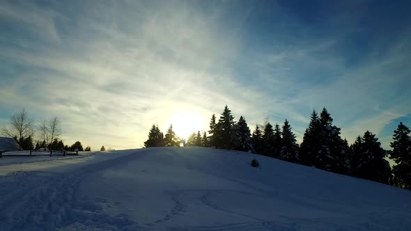 Winter Sunset in the Small Village Near Forests