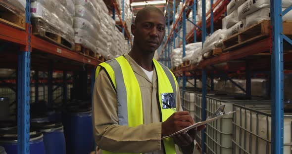 Portrait of young male warehouse worker 4k