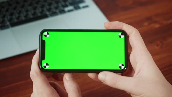 Man Using Smartphone with Chroma Key Closeup