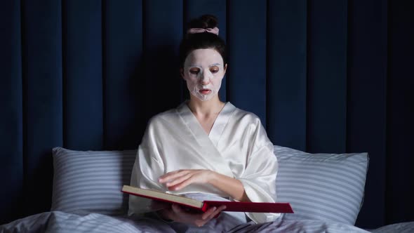 Young Woman Applies Cleansing Mask on Her Face