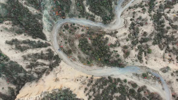Overhead View Of One 4wd Vehicle Driving On Dry River 