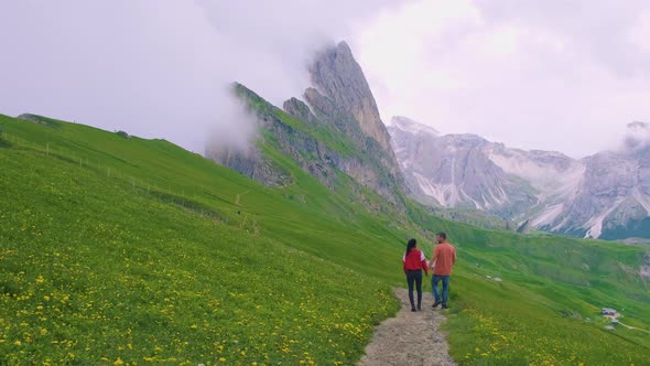 Couple on Vacation Hiking in the Italien Dolomites Amazing View on Seceda Peak