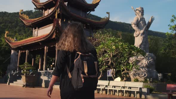 Unknown Female is Walking By Territory of Buddhist Temple