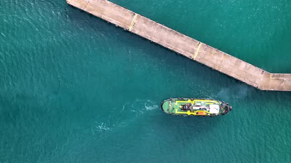 Ship tug sails out of port aerial view Turkey Alanya 4 K