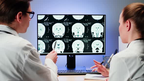 Doctors Examining Xray on Computer Monitor