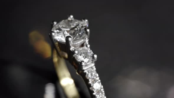 Extreme Detailed of Diamond Ring Close Up Shot While Rotating on Dark Background