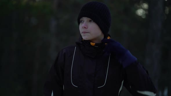 Portrait of Handsome Young Male Athlete Jogging in Winter Woods