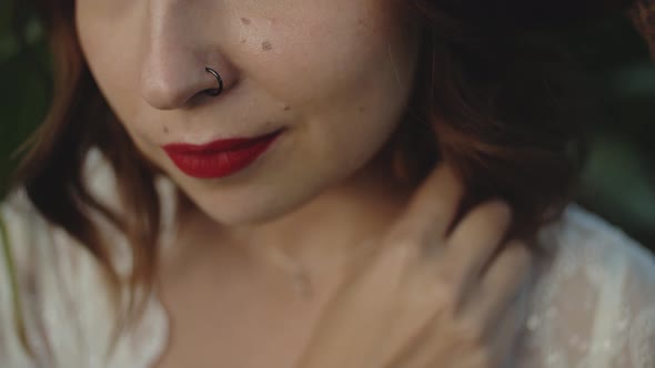 Closeup of Beautiful Woman's Mouth with Red Lipstick Smiling and Slow Motion