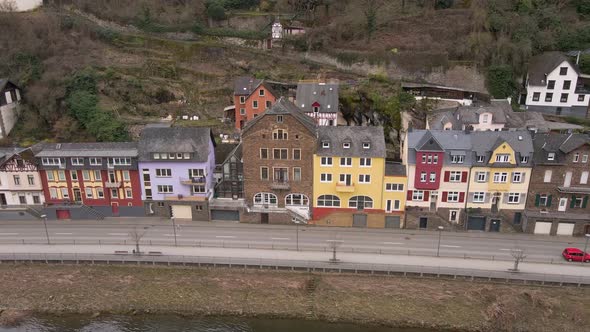 downward tilting drone footage with a view of the typical houses on the banks of the Moselle river i