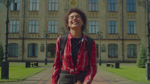 Excited Lovely African American Female Student Celebrating Academic Success alt