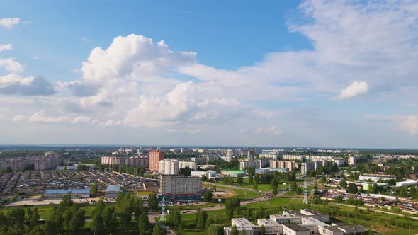 The Outskirts of a Modern City Surrounded By Green Trees and Plantations