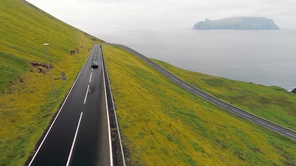 Pedestrians Walk Across the Magnificent Road with Picturesque Scenery.