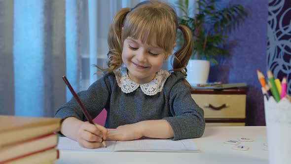 Child Girl Studying Homework During Online Lessons at Home Kid Making Video Call Distance Education