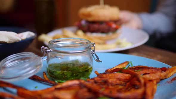 Eating Healthy Vegan Burger With French Fries . Closeup.