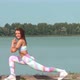 Young woman warming up during exercising at sport playground outdoor - VideoHive Item for Sale