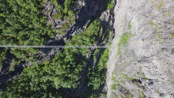 Via Ferrata bridge at mount Hoven in Loen seen from above - Birdseye aerial Norway with unrecognizab