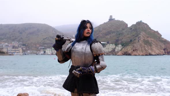 Woman Warrior in Armor Against Fortress on Rock and Sea