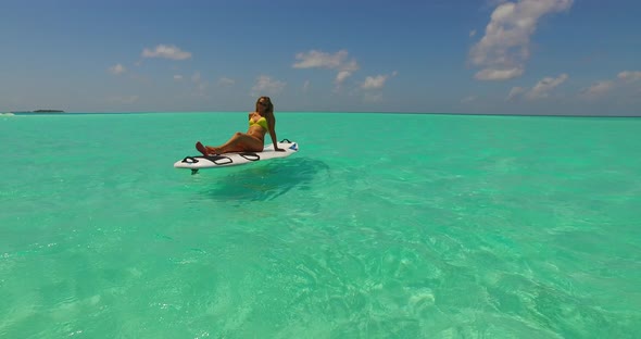 Sexy happy ladies on holiday by the sea on beach on summer white sand and blue background 4K