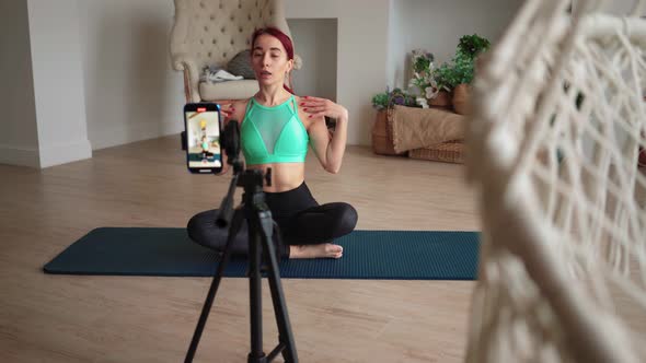 Fit Sports Woman Filming Her Fitness Video Blog on Mobile Phone