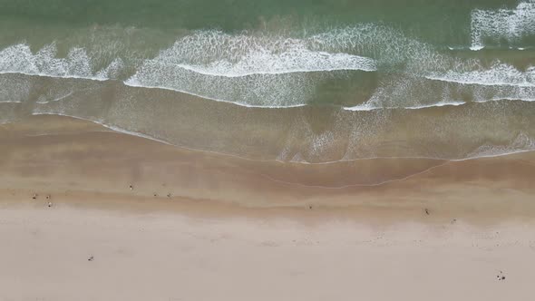 Portrush Whiterocks Beach In Portrush, Northern Ireland - Sandy Beach With Ocean Waves From The Caus