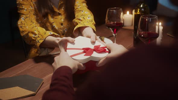 Surprised Woman Opening a Red Gift Box