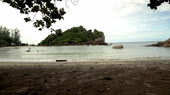 Time lapse of a beach in South Thailand. People of swimming in the water.