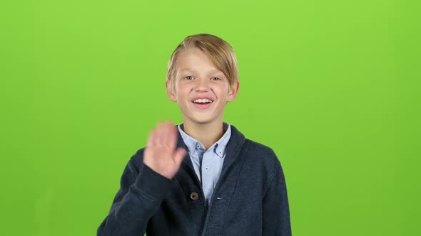 Boy Waves and Calls a Friend with Him. Green Screen