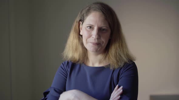 Indoor Closeup of Positive, Smiling Middle Aged Caucasian Woman