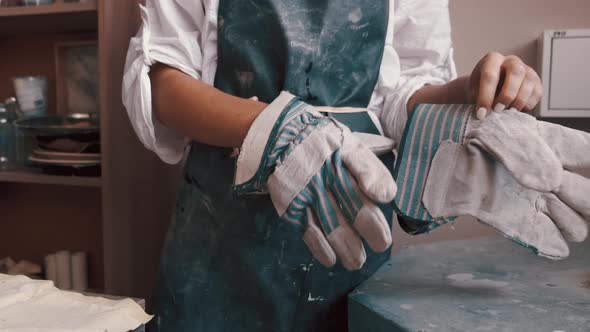 Potter Preparing the Pottery Kiln for the Baking Process for Her Dish