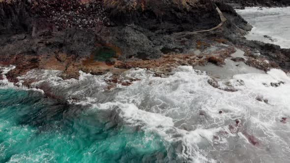 Panorama Vertical, Steep Volcanic Shore, Stormy Ocean, White Foam From the Waves 