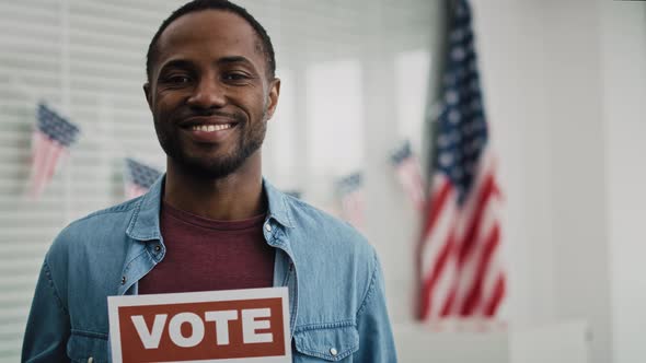 Video of black man with voting card. Shot with RED helium camera in 8K