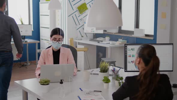 Workers Wearing Protective Face Mask Talking About Business Project